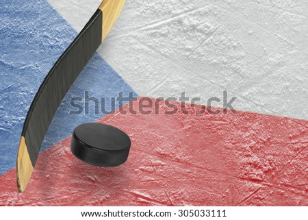 Hockey puck, stick and a fragment of an image of the Czech flag
