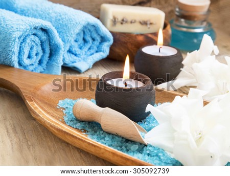 Spa Still Life Setting with White Lilies, Candles and Sea Salt