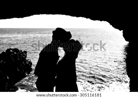 Silhouette of a couple near the sea