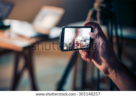 Person is taking photo with a smartphone. Royalty-Free Stock Photo #305148257