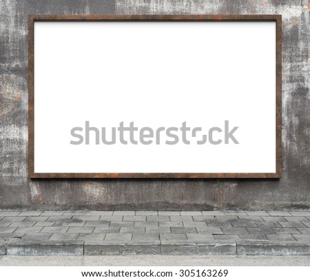Blank advertising billboard with rusty frame on a dirty grunge wall.