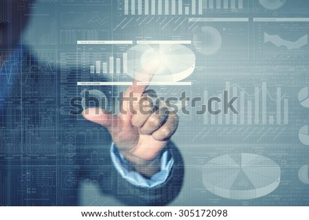 Close up of businessman touching virtual panel with finger