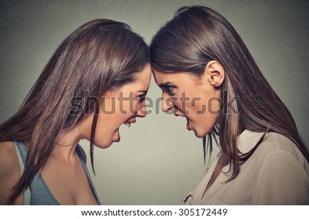Two women fight. Angry women, looking at each other with hatred, blaming for problem. Friendship difficulties, problems at work concept  Royalty-Free Stock Photo #305172449