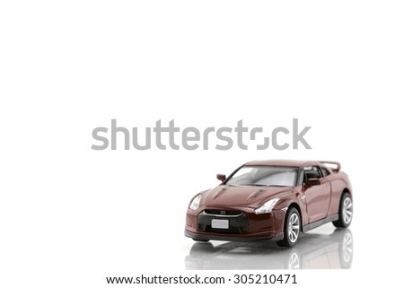 Red toy car isolated on white