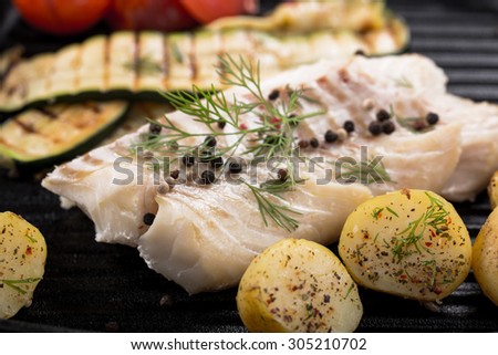 grilled fish on frying pan