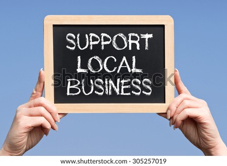Support Local Business - female hands with chalkboard