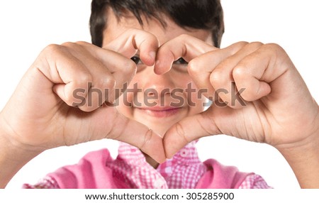 Boy making a heart with his hands 