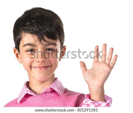 Kid saluting over white background 