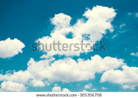 White cloud on blue sky in vintage filter
