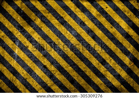 Black and yellow grunge warning hazard background