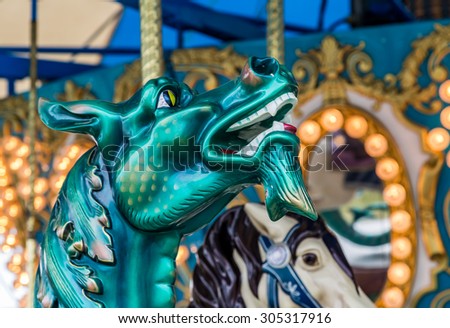 Beautiful dragon on a carousel against colorful background