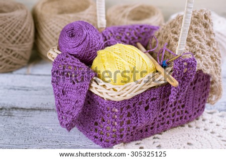 Yarn for crochet and knitted openwork napkins on shabby wooden boards