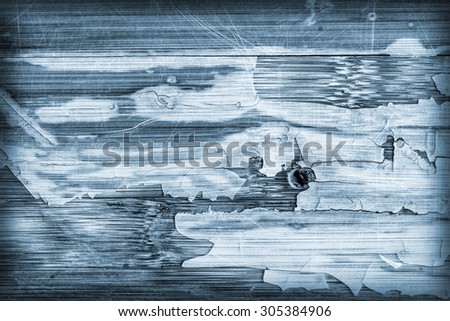 Photograph of Blue stained, old, weathered, varnished wooden laminated panel, cracked, scratched, vignette grunge texture.