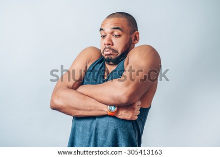 black man surprised his arms crossed