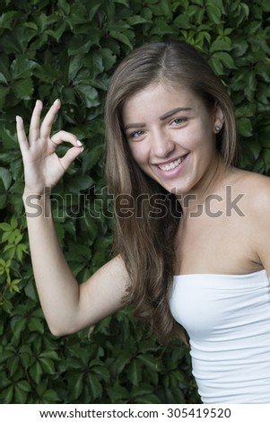 cute girl make sign with her right hand