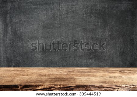 dark background of black board and dark brown shabby desk top 