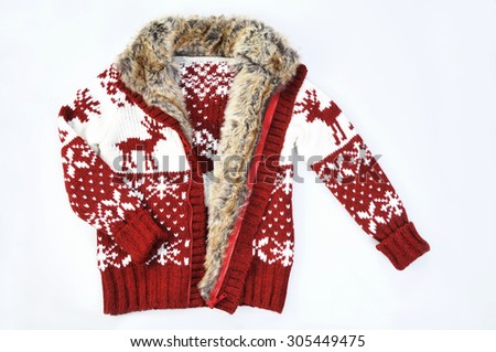 Pullover with fur isolated on white. Norwegian pattern with deers