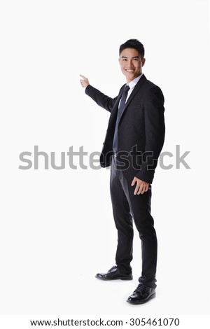 full body picture of a happy business man presenting something on a white background