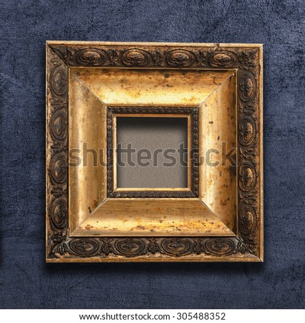 vintage gold picture wood retro frame on a black background wall