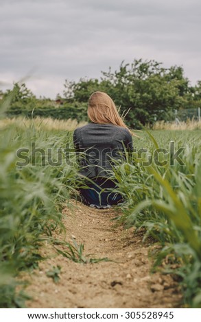 Girl in a green field