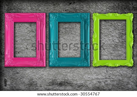 Colorful modern picture frames on a grey textured background.