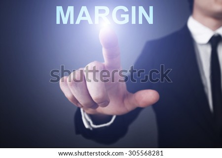 Businessman pressing button on virtual touch screen  and select "margin". Business concept. Internet concept.