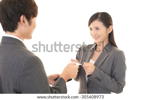 Smiling businessman and businesswoman