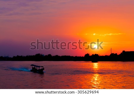art tone,soft focus and silhouette a boat on the lake with sundown time background
