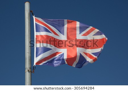 England UK Wavy Flag under blue sky