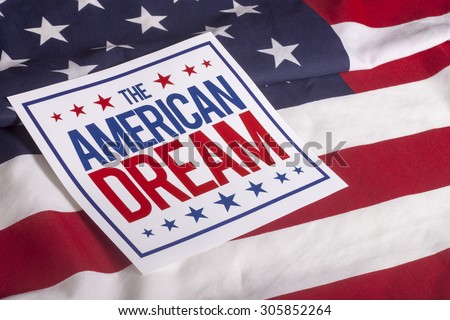 The American Dream sign on US flag Royalty-Free Stock Photo #305852264