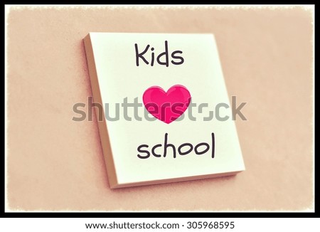 Text kids love school on the short note texture background