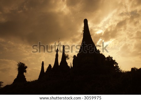 pagoda silhouettes at sunrise in indein myanmar