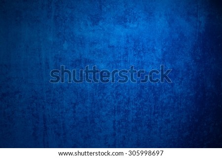 Cool dark blue grunge background of an old surface