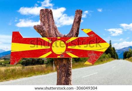 Macedonia Flag wooden sign with road background