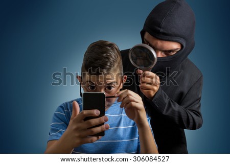 comic masked man spying data from smartphone of teenager Royalty-Free Stock Photo #306084527