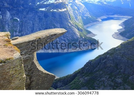 Norway tourism attraction - Trolltunga (Troll's Tongue) rock in Hordaland county. Ringedalsvatnet lake. Royalty-Free Stock Photo #306094778