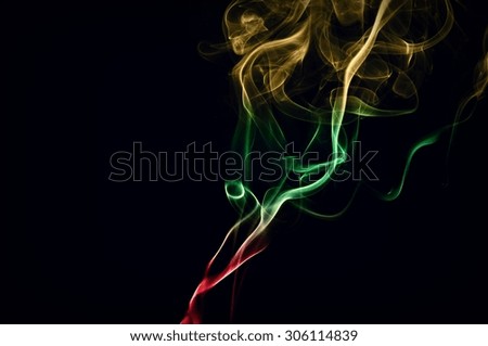 Abstract color smoke on black background, smoke background,red and green and brown ink background, red ,green, brown