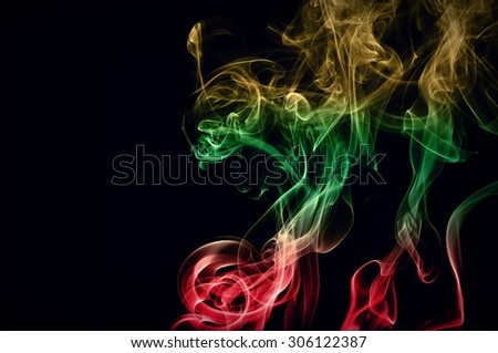 Abstract color smoke on black background, smoke background,red and green and brown ink background, red ,green, brown