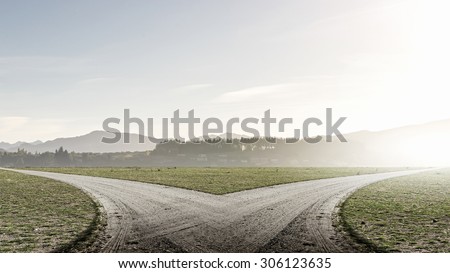 Concept of choice with crossroads spliting in two ways Royalty-Free Stock Photo #306123635