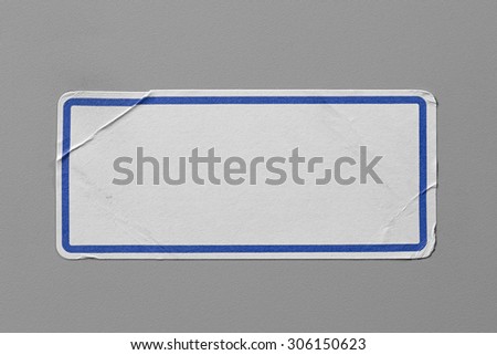 Label Adhesive Close Up on Grey Background with Real Shadow. Top View of Adhesive Paper Tag. Stickers with Copy Space for Text or Image