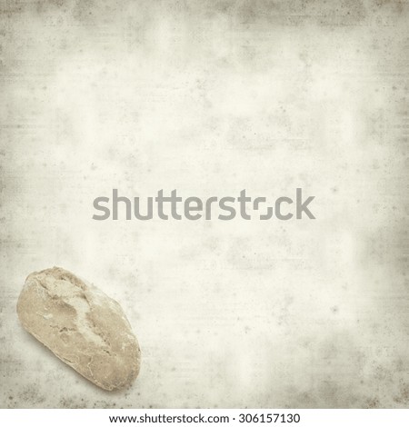 textured old paper background with gralitian mini bread