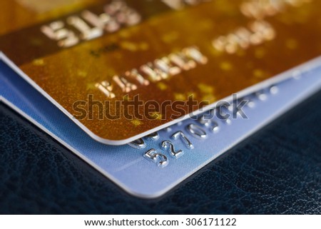 Close-up picture two credit cards with numbers. Macro. Small Depth of field