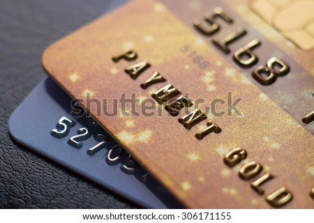 Close-up picture two credit cards with numbers. Macro. Small Depth of field