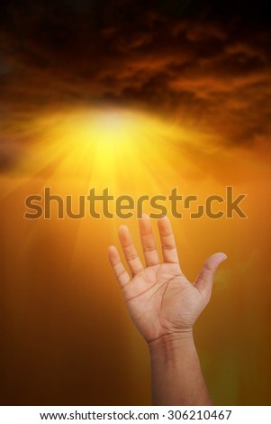 Hand blessings on storm background