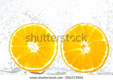 fresh orange with bubbles in the water