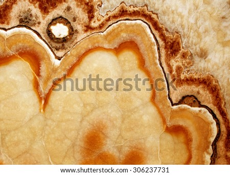 background, unique texture of natural stone , red pink yellow onyx marble