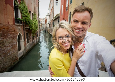 Couple taking selfie picture in Venice