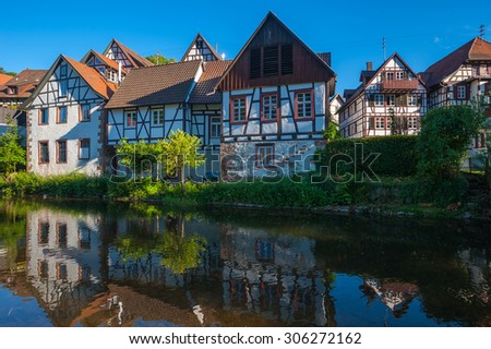 Historic townscape with old half-timbered houses on the river Kinzig in Schiltach, Black Forest, Baden-Wurttemberg, Germany, Europe Royalty-Free Stock Photo #306272162