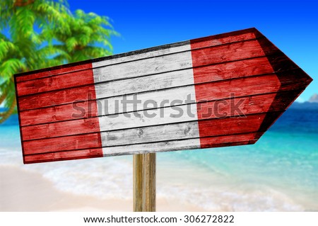 Peru flag wooden sign with on a beach background
