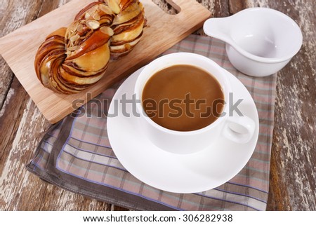 cup of coffee on the table and bread